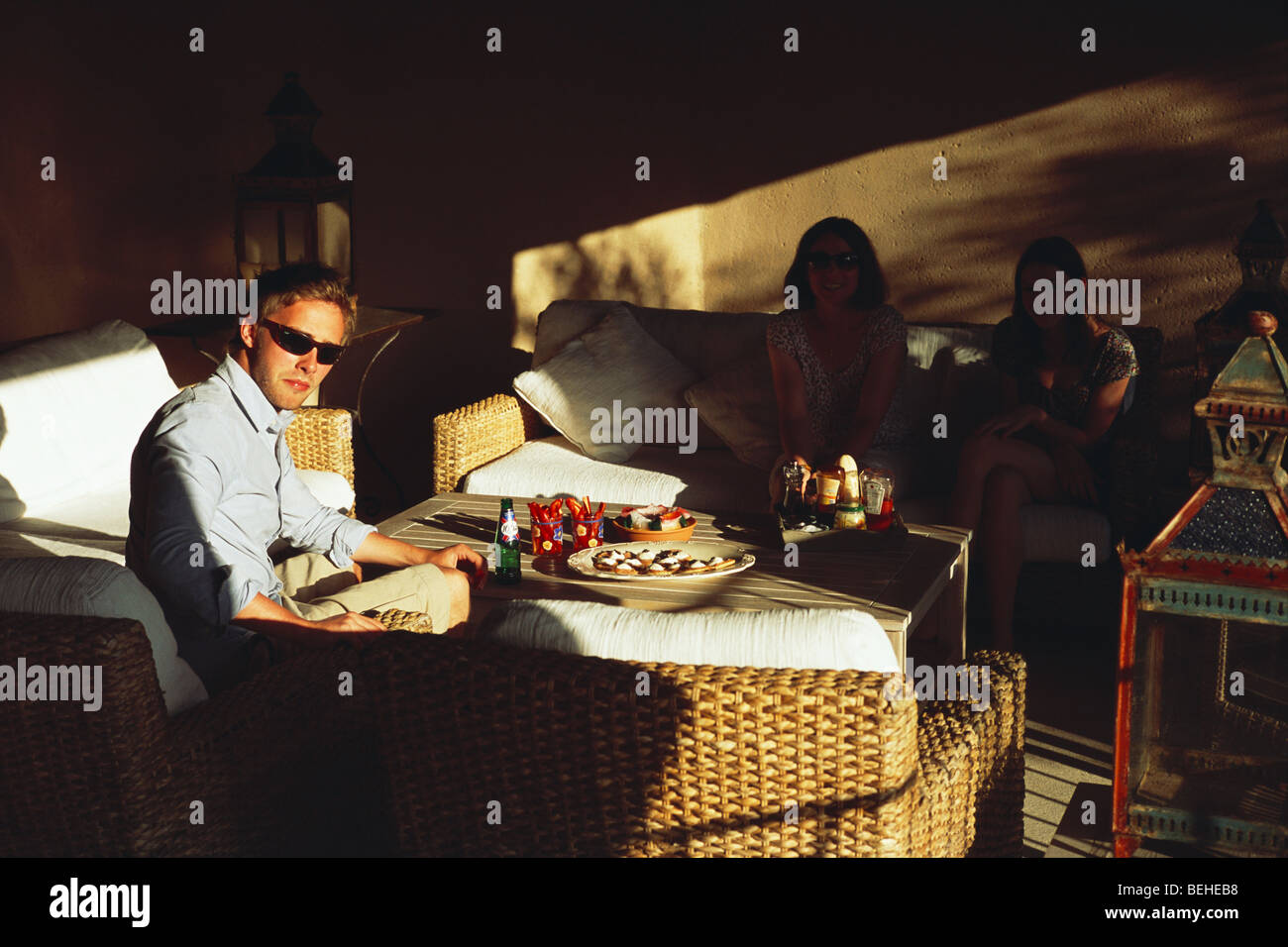 Young Englishman on holiday enjoys meal outside in garden room Provence France Stock Photo