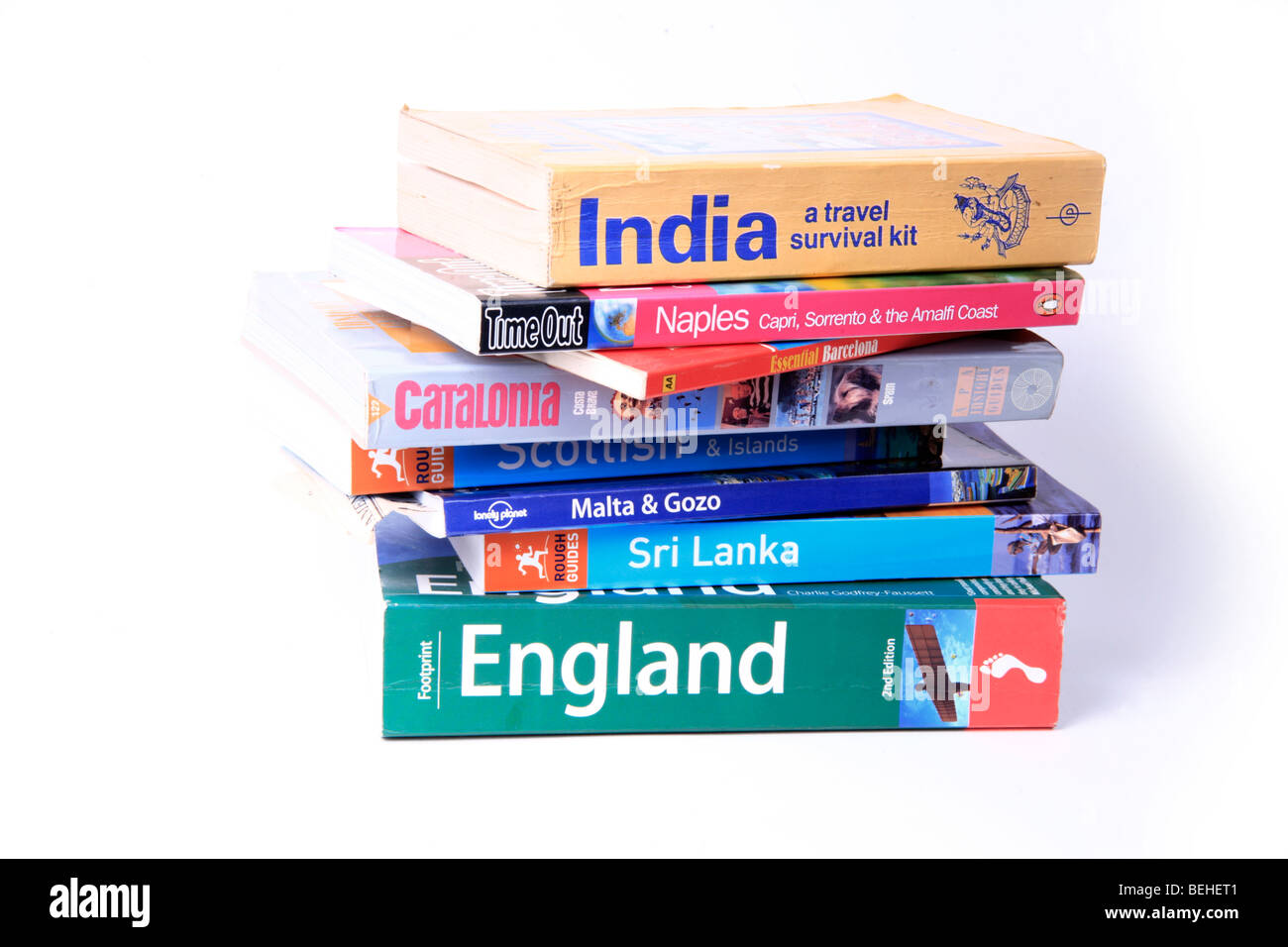 Pile of Destination Guides and Travel Books Stock Photo