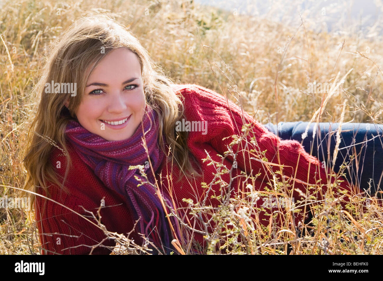 Portrait of a young woman smiling Stock Photo - Alamy