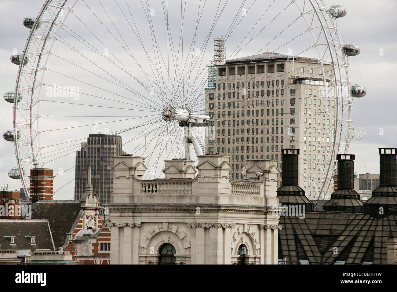 Rooftop view over London, England, UK taking in the London Eye wheel, the shell building and portcullis house. Stock Photo