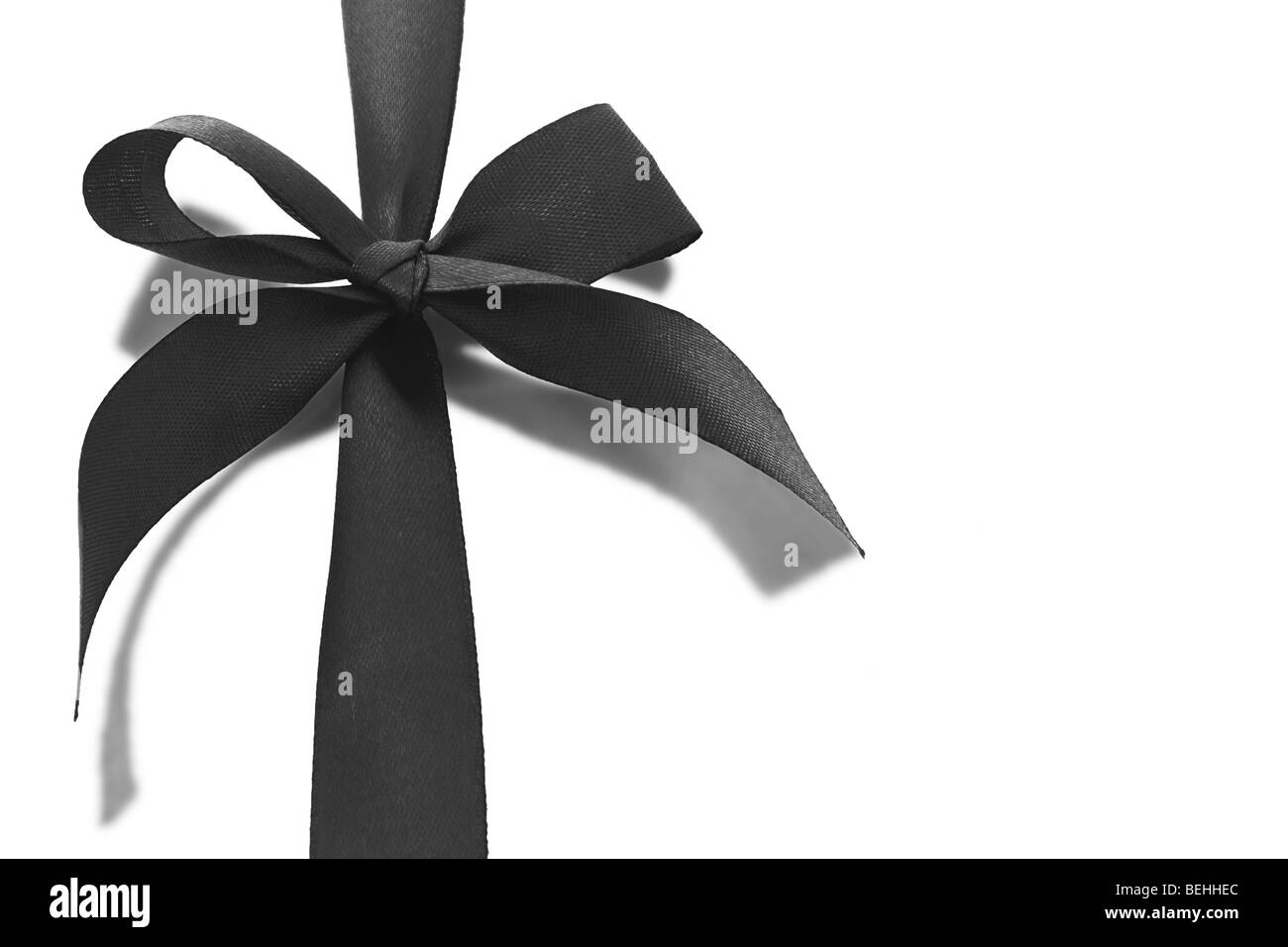 Black bow ribbon with reflection on white background Stock Photo