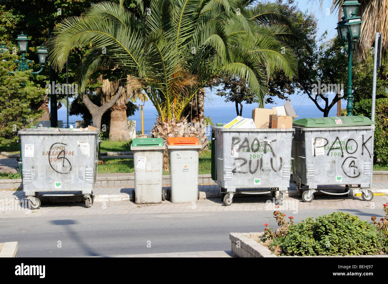Wheelie bins in the Greek seaside resort of Kallithea Kassandra northern Greece Stock Photo