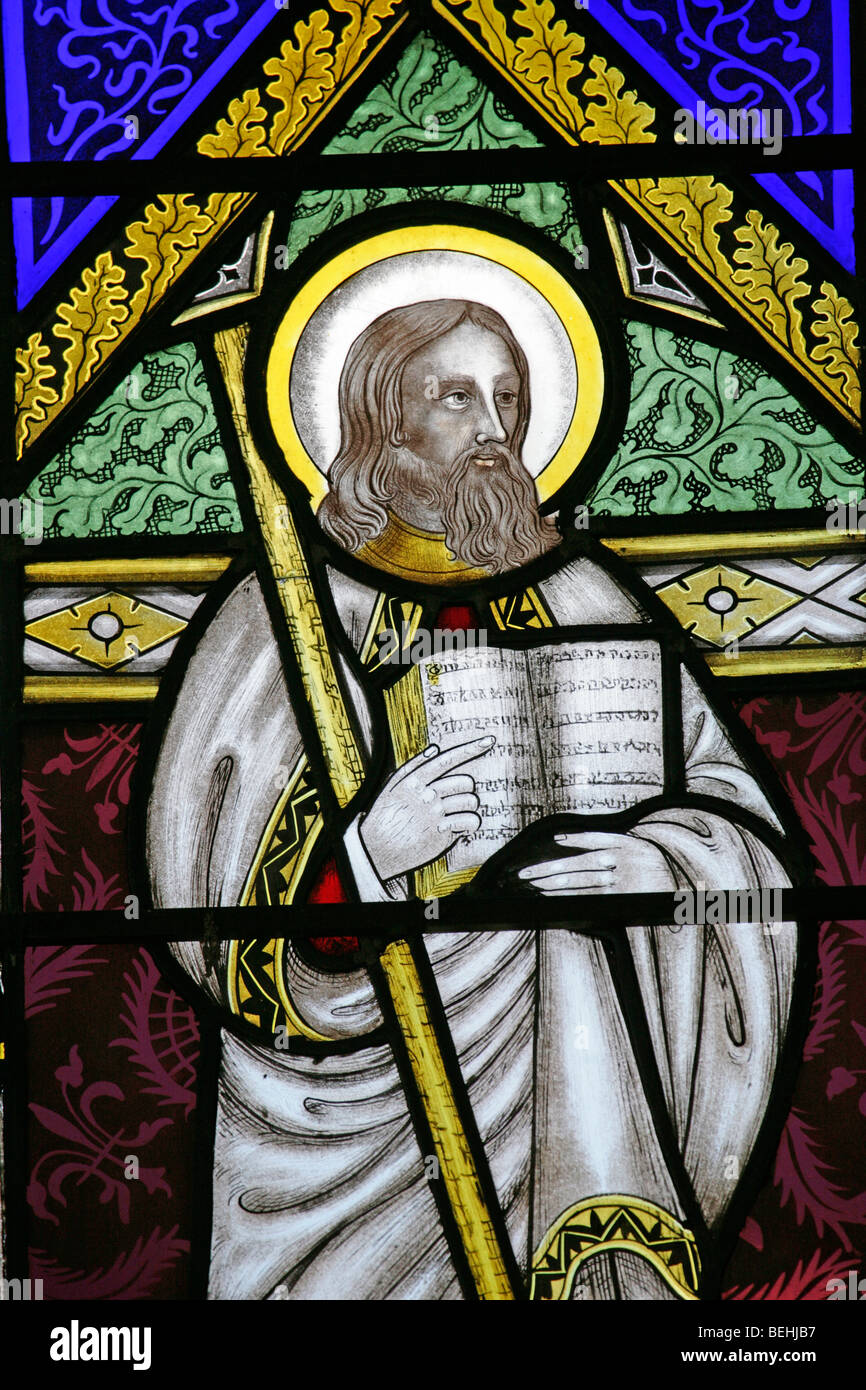 A stained glass window depicting St Barnabas the Apostle, All Saints Church, Wighton, Norfolk by Joseph Grant of Costessey Stock Photo