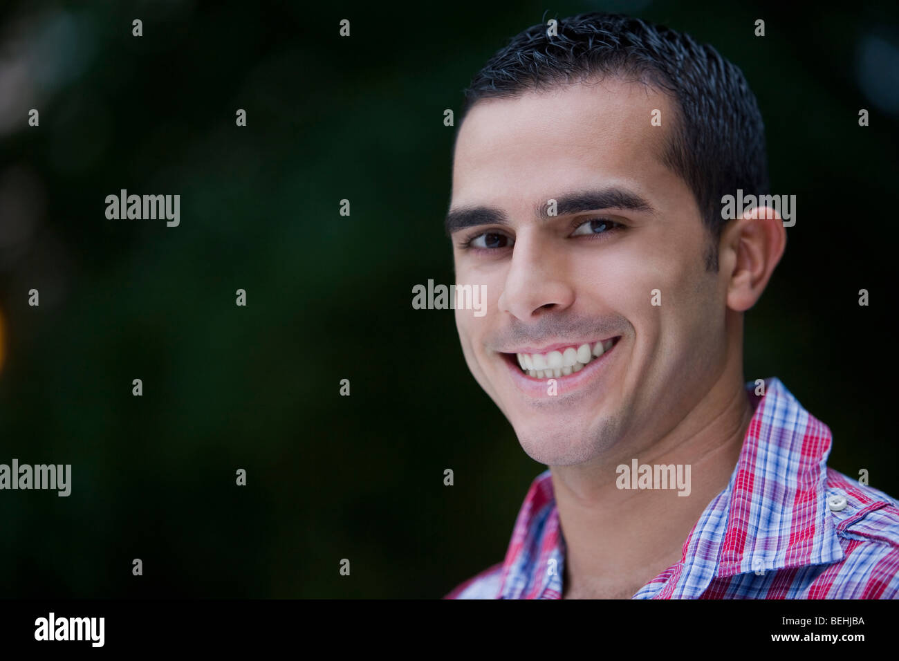 Portrait of a young man smiling Stock Photo - Alamy
