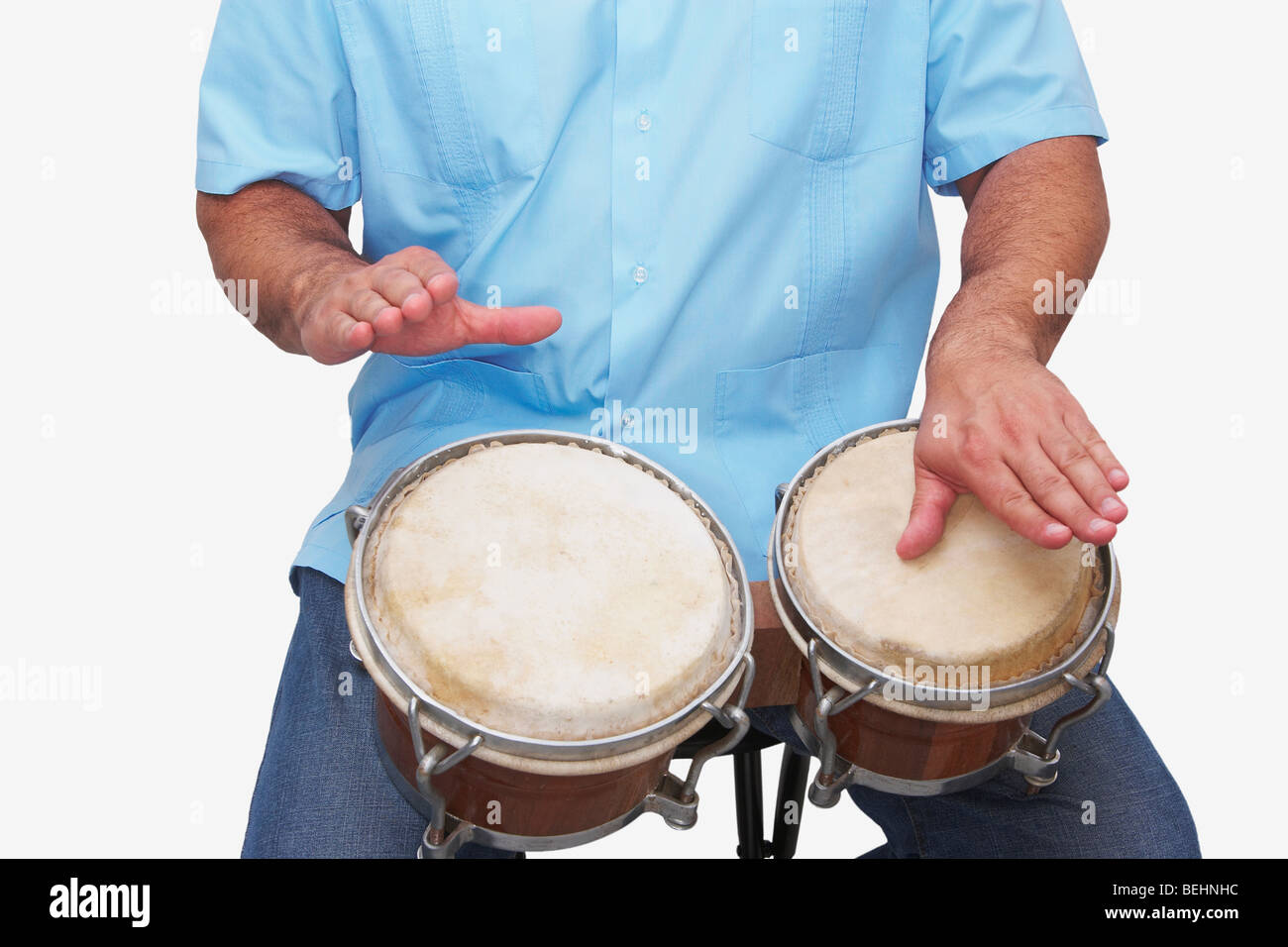Mid section view of a man playing bongo drums Stock Photo Alamy