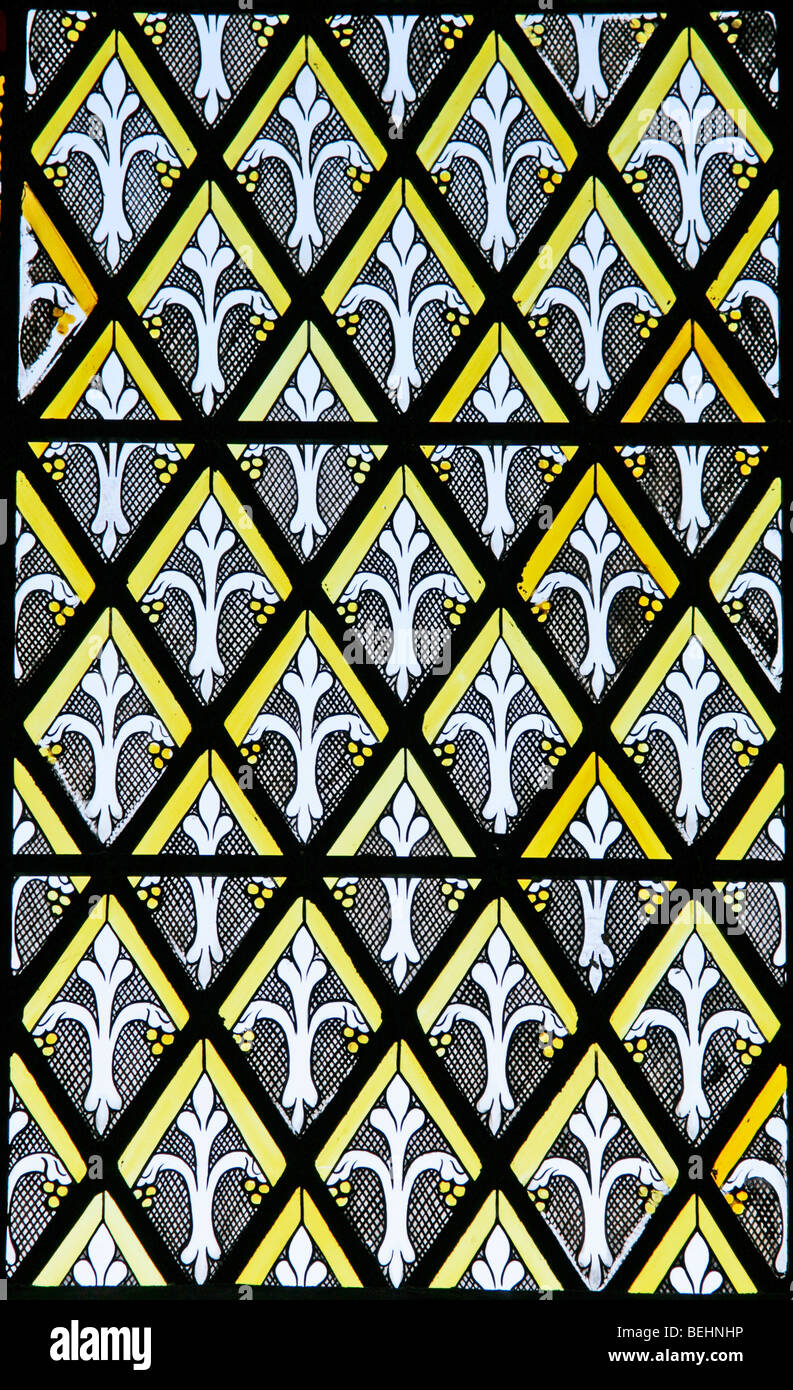 Stained glass window illustrating the use of bright geometric patterns known as Grisaille, All Saints Church, Wighton, Norfolk Stock Photo