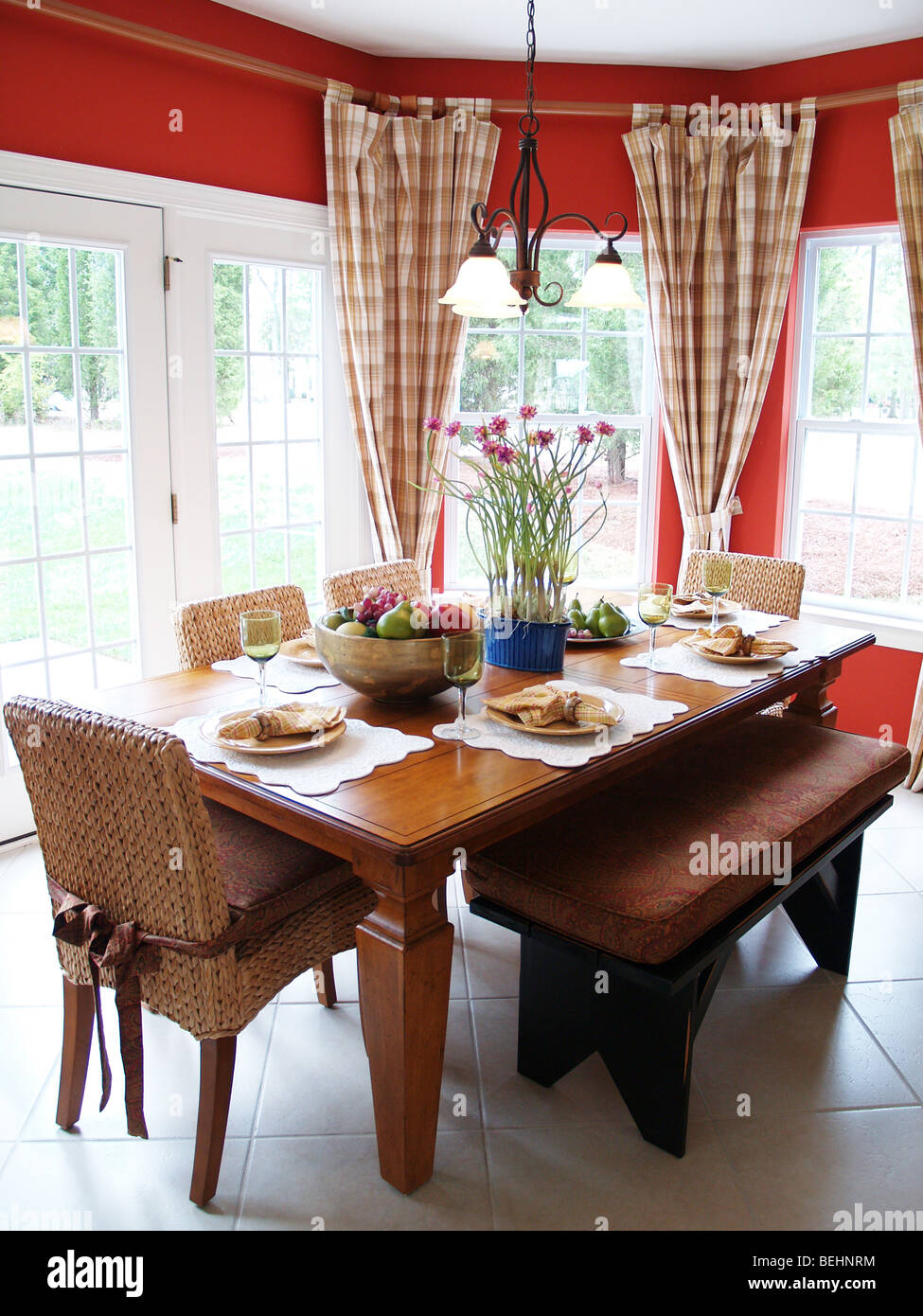 A rustic table set for a meal in a bright breakfast room Stock Photo