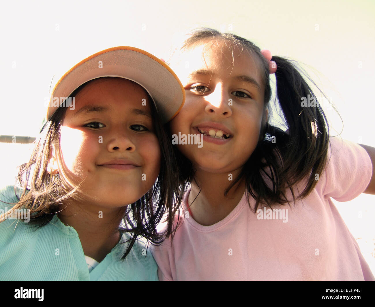 Girls sitting on baseball stands Stock Photo Alamy
