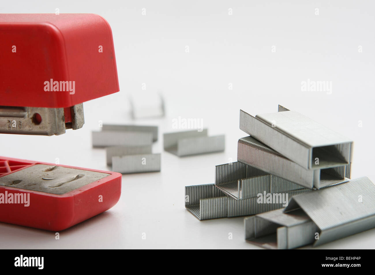 Cutout of a Stapler and pins on white background Stock Photo - Alamy