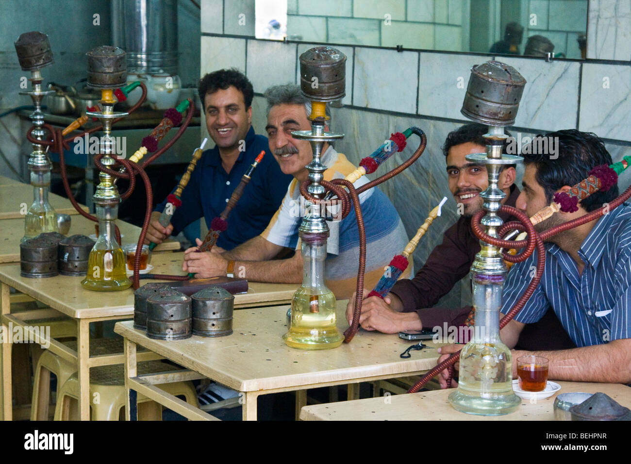 Men Smoking Hookahs in a Teashop in Tehran Iran Stock Photo