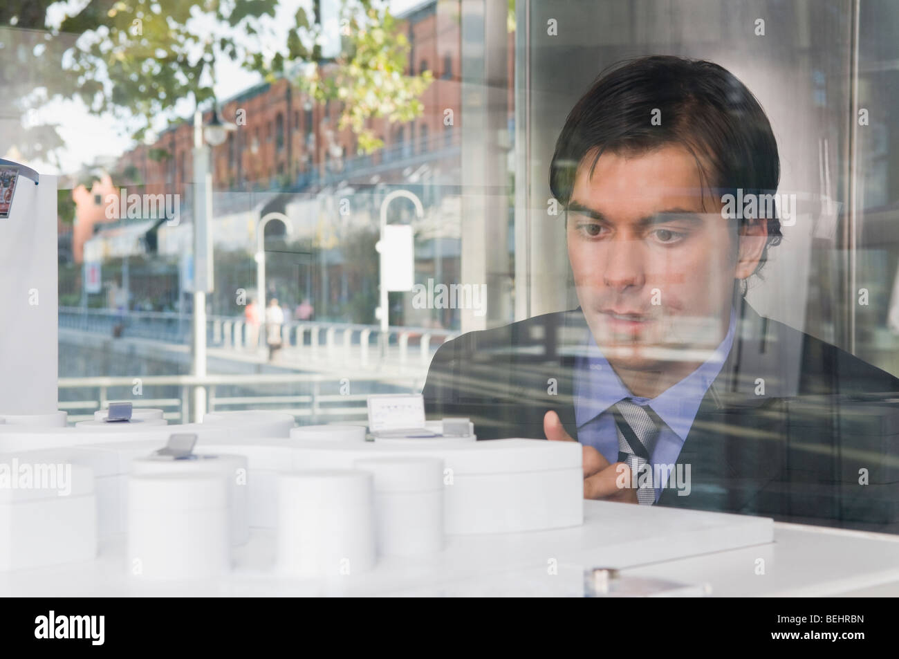 Businessman looking at an architectural model Stock Photo