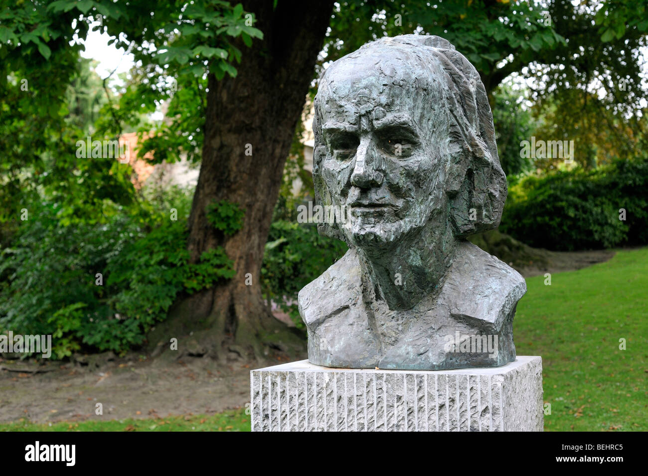 Bust of the surrealist painter Paul Delvaux in city park at Veurne / Furnes, West Flanders, Belgium Stock Photo