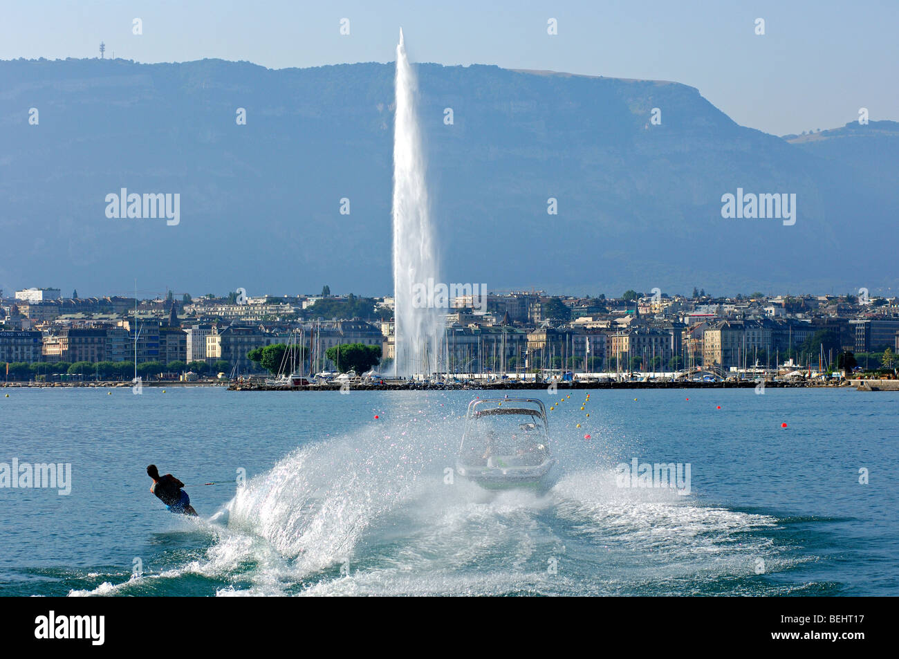 Water skiing in the Rade in front of the giant fountain Jet d'Eau, Lac  Geneva, Mount Saleve behind, Geneva, Switzerland Stock Photo - Alamy