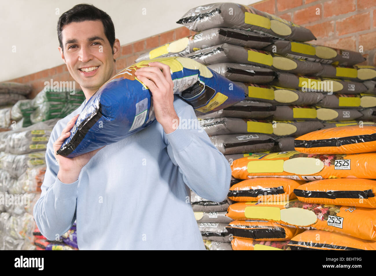 Man carrying sack on shoulder hi-res stock photography and images - Alamy