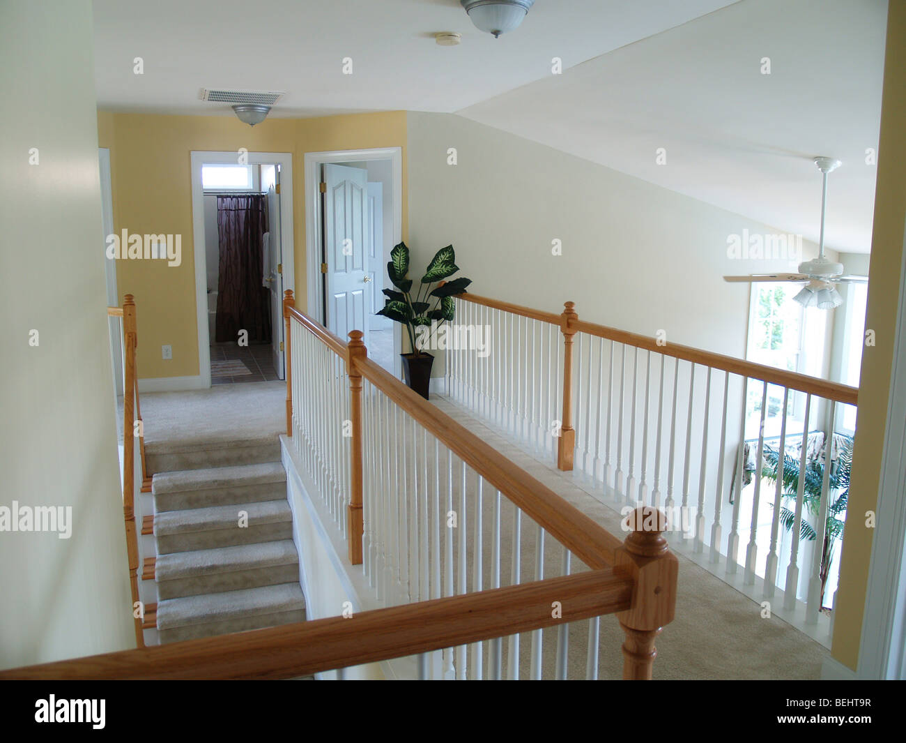 View from an interior balcony of the landing overlooking the family room Stock Photo