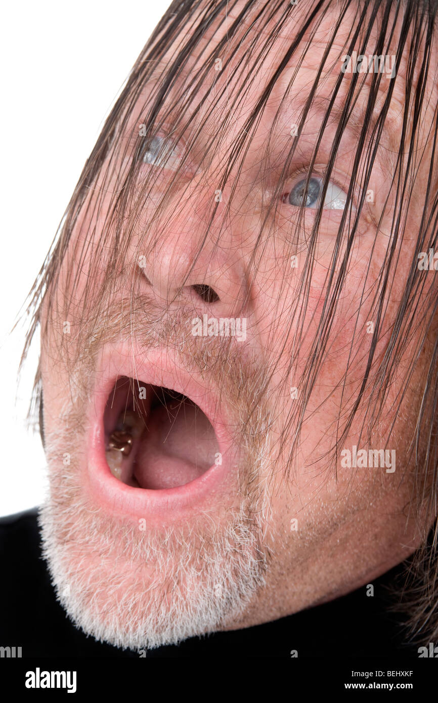 Wild-looking man with surprised look on his face. Stock Photo