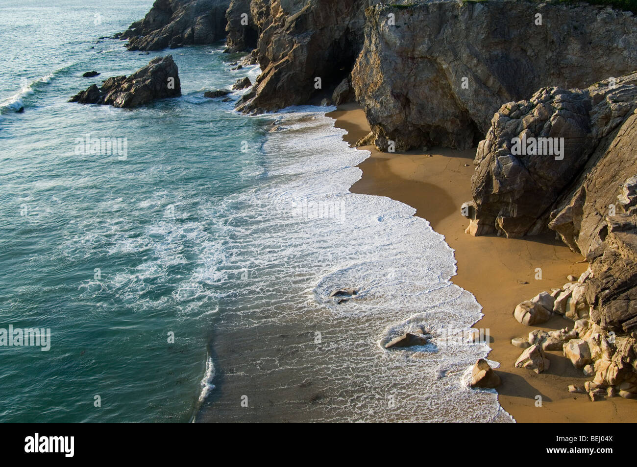 Sandy beach and cliff face at the Côte Sauvage / Wild Coast, Quiberon, Brittany, France Stock Photo