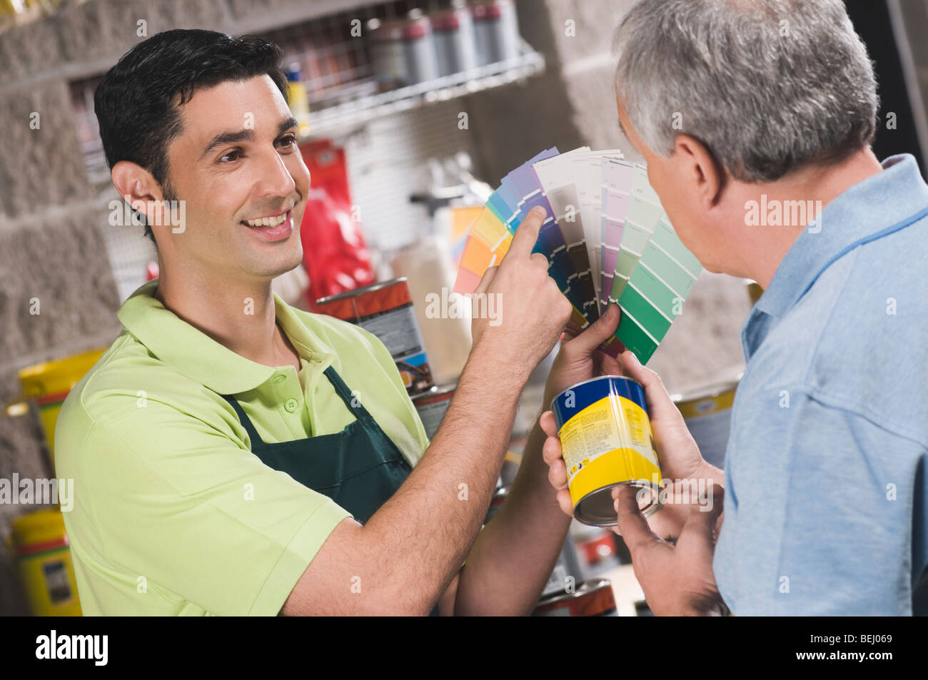 Salesperson working in hardware store hires stock photography and