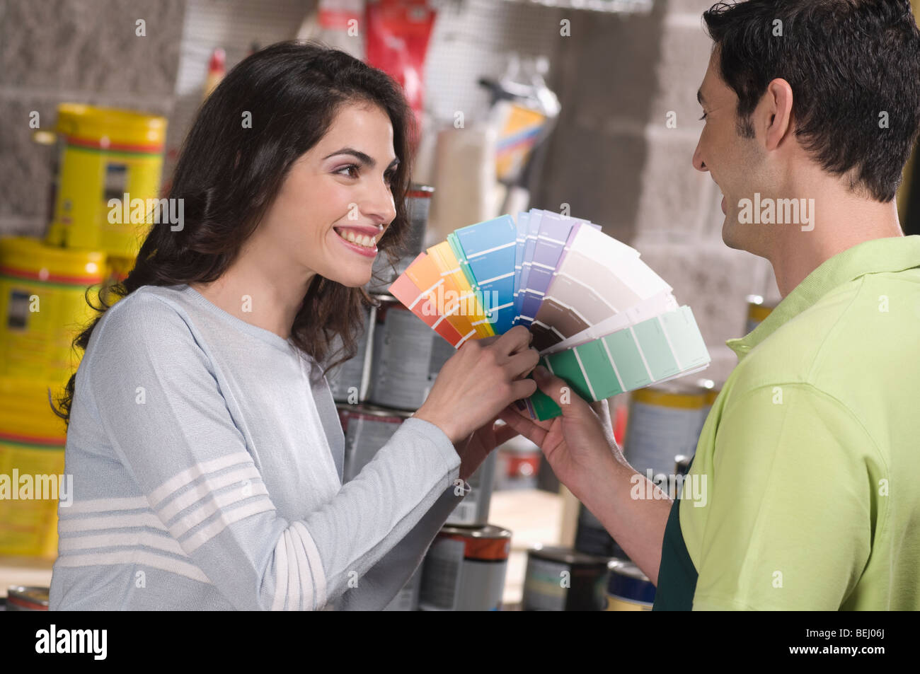 Salesperson working in hardware store hires stock photography and