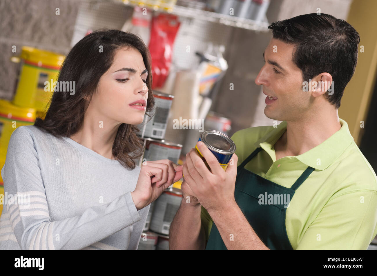 Salesperson working in hardware store hires stock photography and