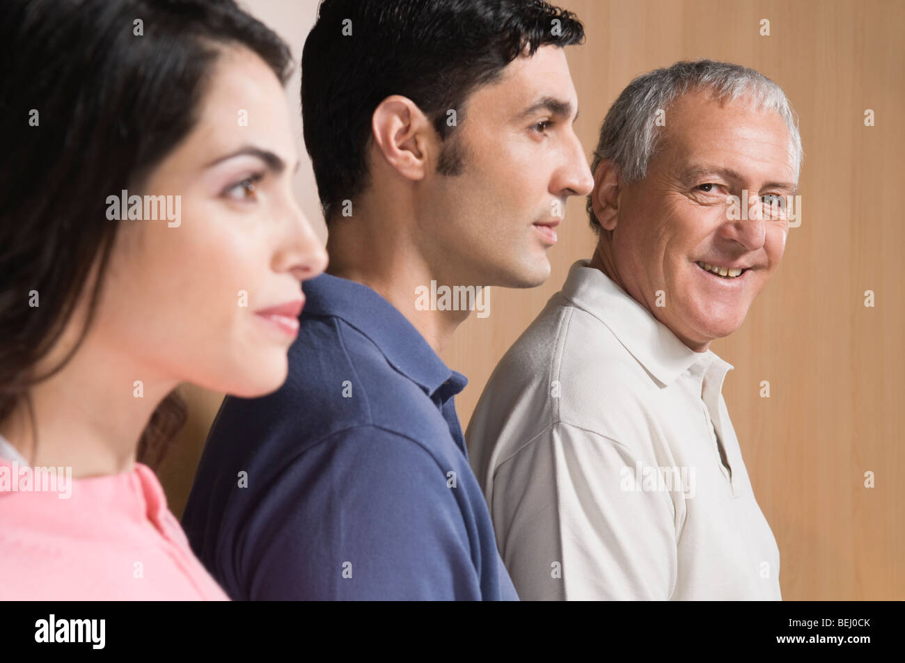 Man smiling with his family beside him Stock Photo