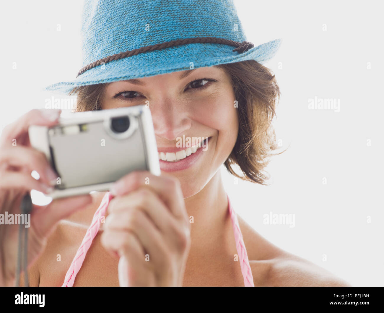 Woman taking a picture with a digital camera Stock Photo