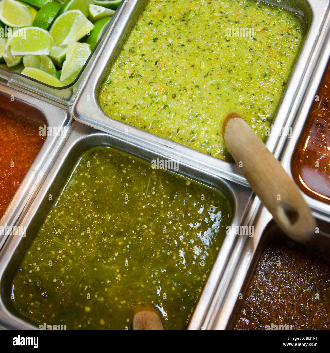 High angle view of salsa verde and tomatillo salsa on a food counter Stock Photo