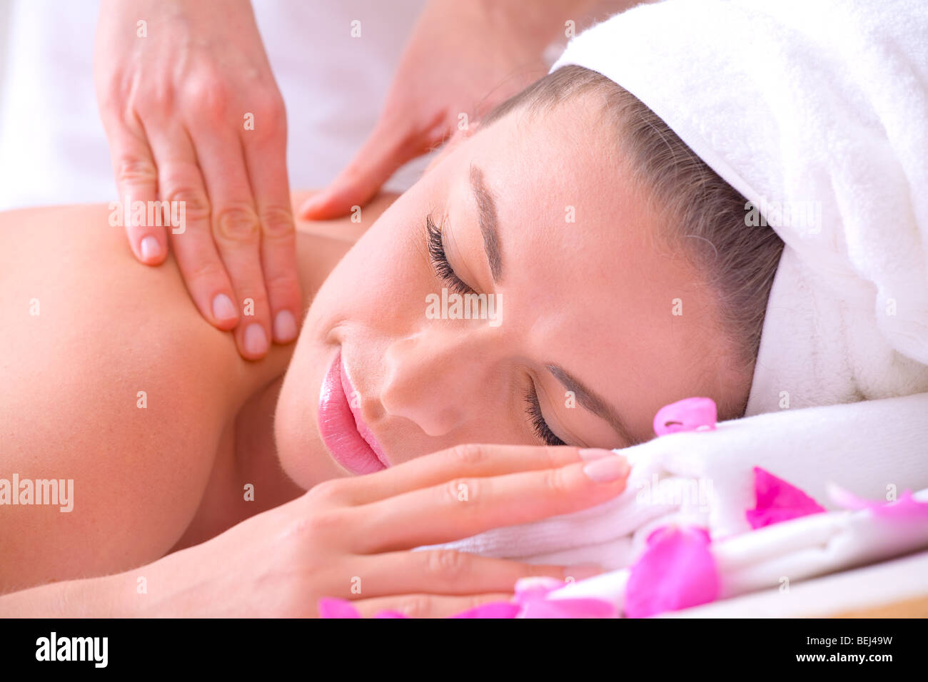 Young attractive girl receiving massage at spa resort Stock Photo