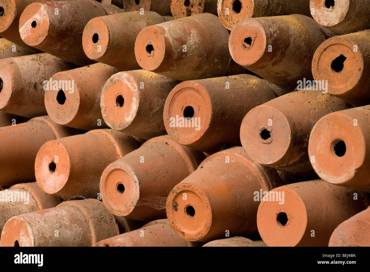 Gardeners delight. Rows of terracotta plant pots in storage, drying off