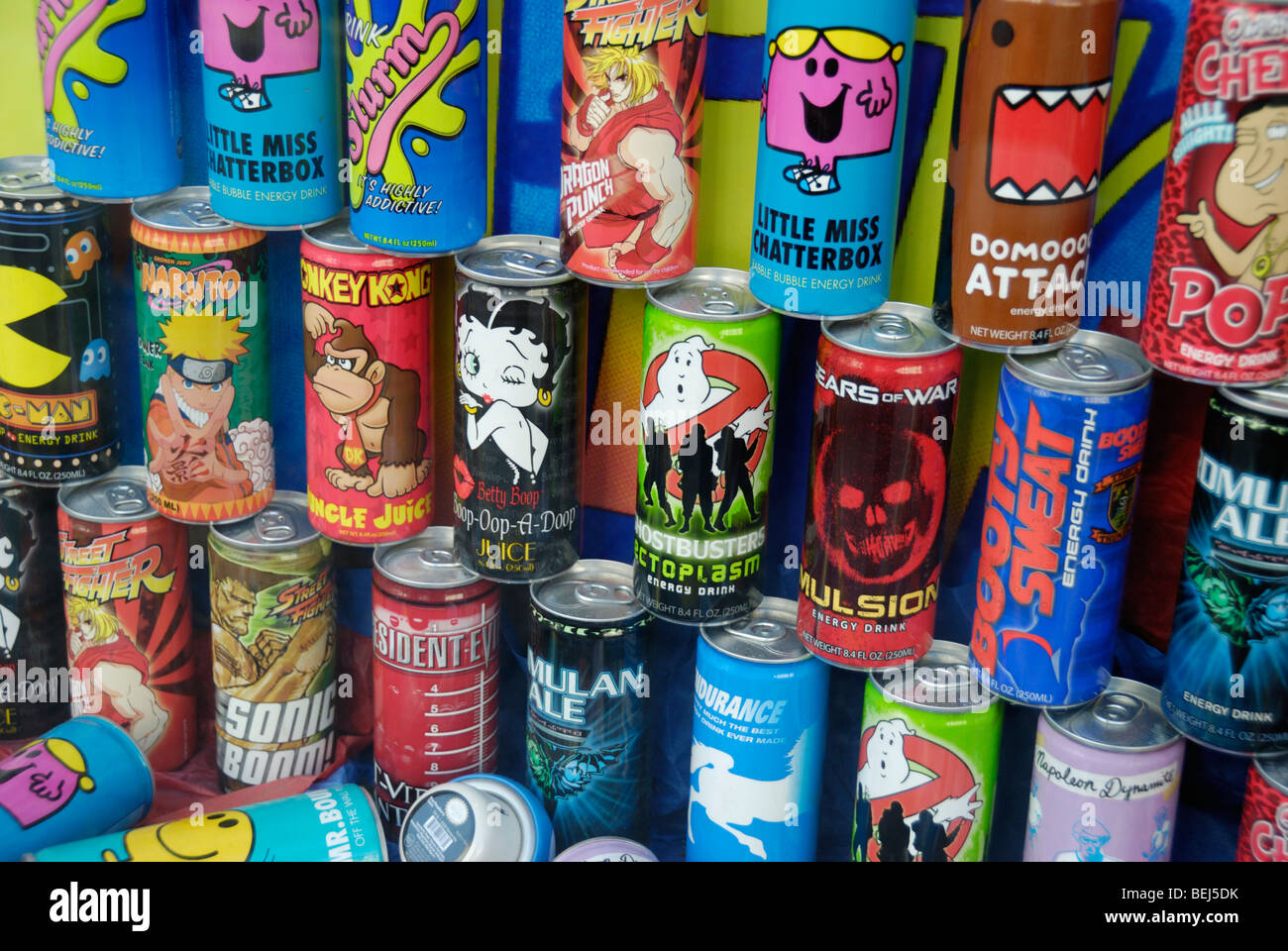 Cartoon characters on colourful drink cans in a shop window display Stock Photo