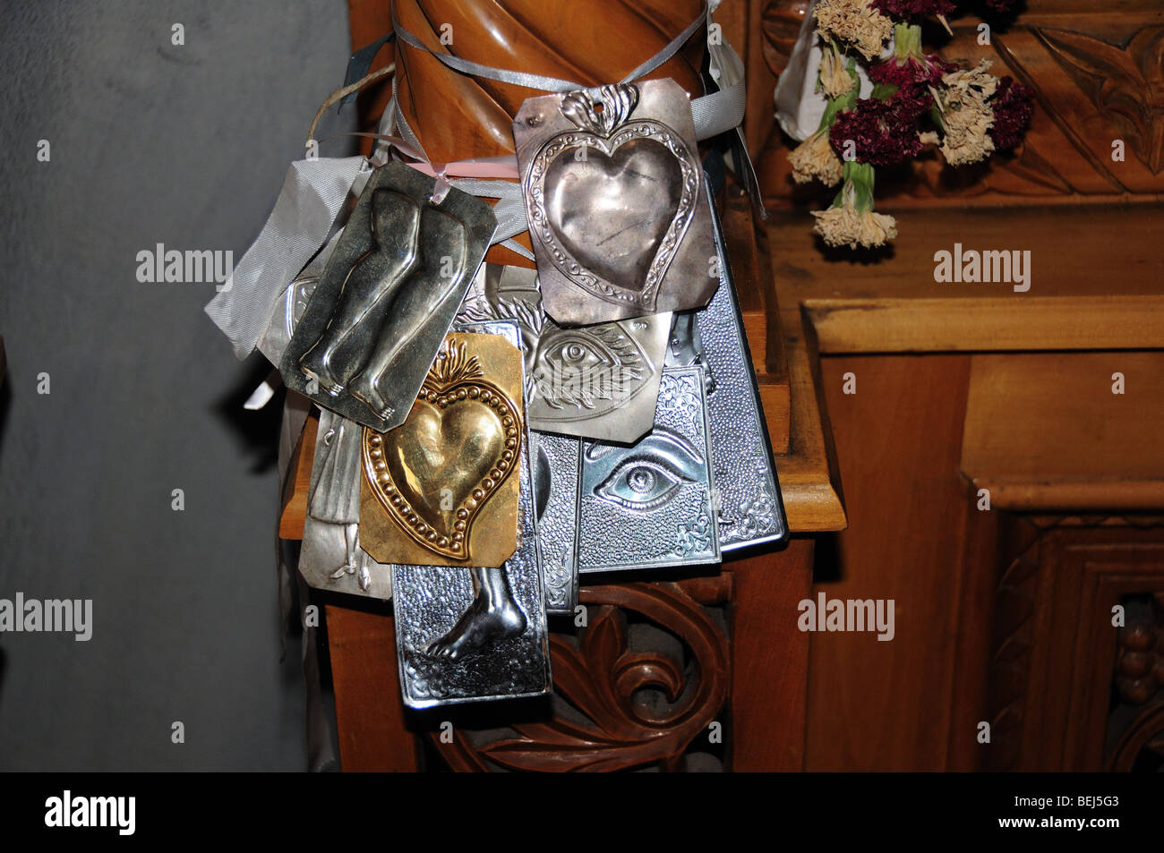 Icons left by worshipers at a Greek Orthodox Church Panagia Fishing Village Evia Greece Stock Photo