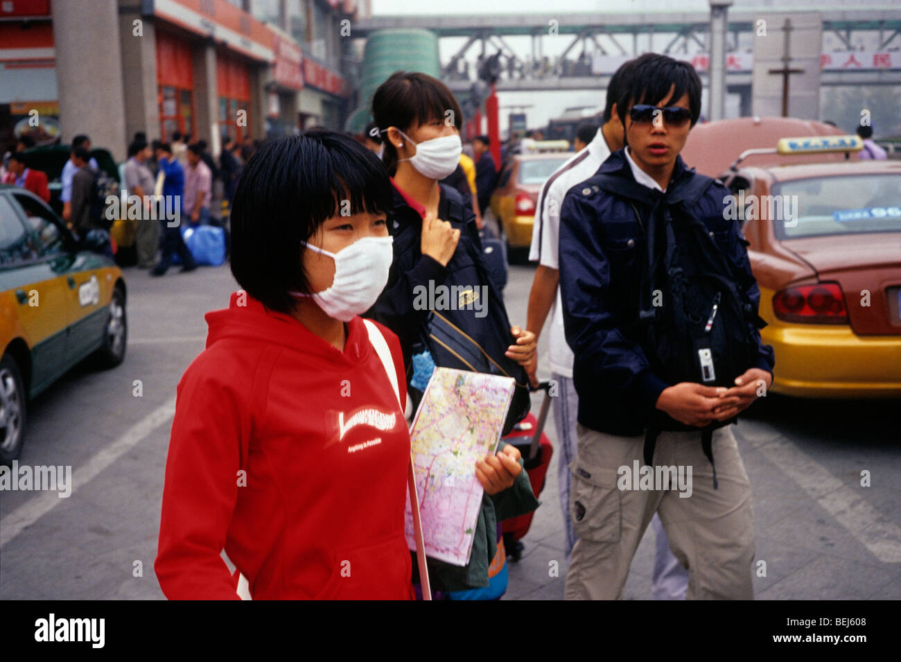 A girl and a lady wear mask to protect against severe pollution in Beijing, China. 30-Sep-2009 Stock Photo