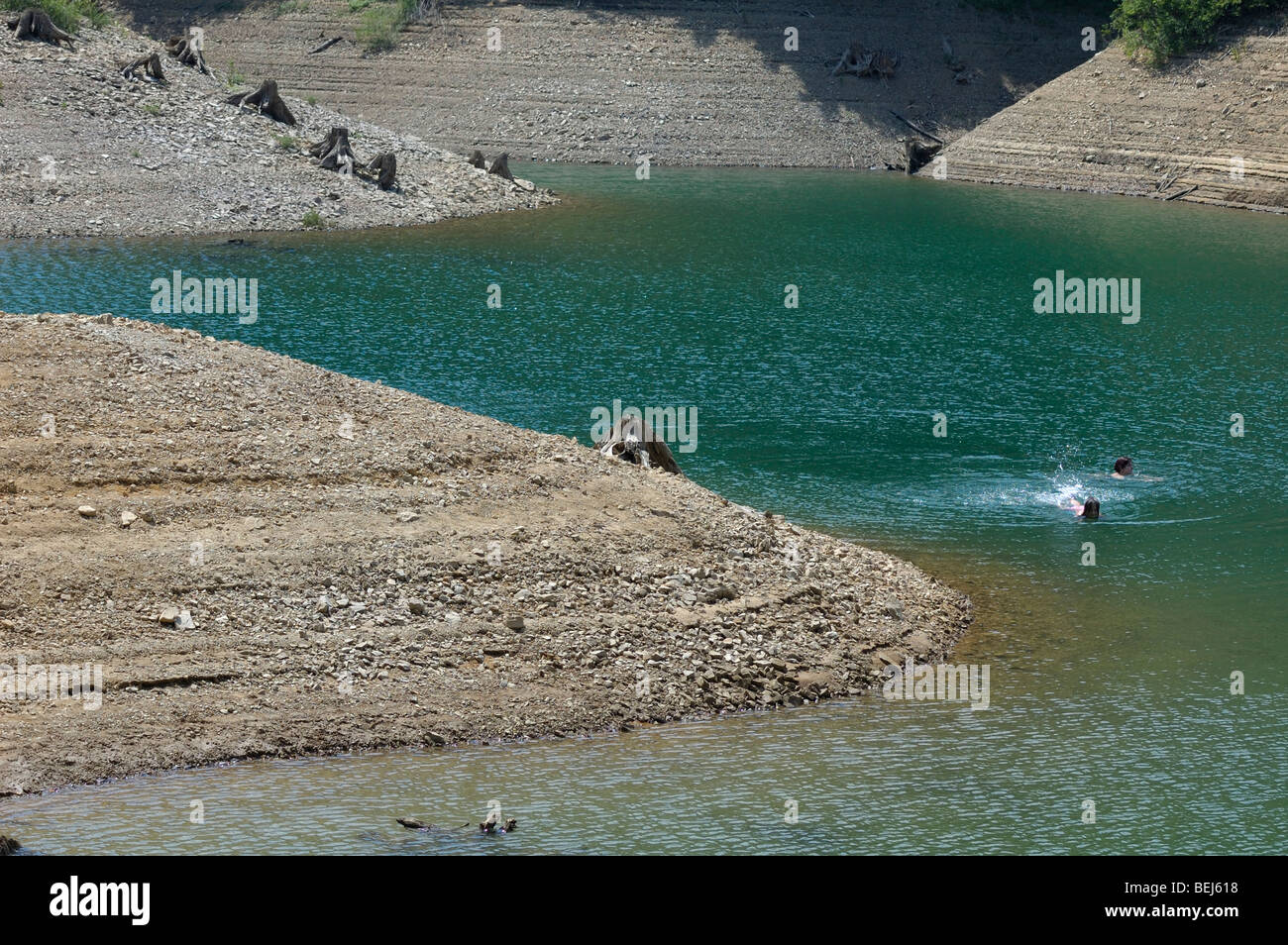 People swimming in Lokvarsko jezero lake near Lokve, Gorski kotar, Croatia, Europe Stock Photo