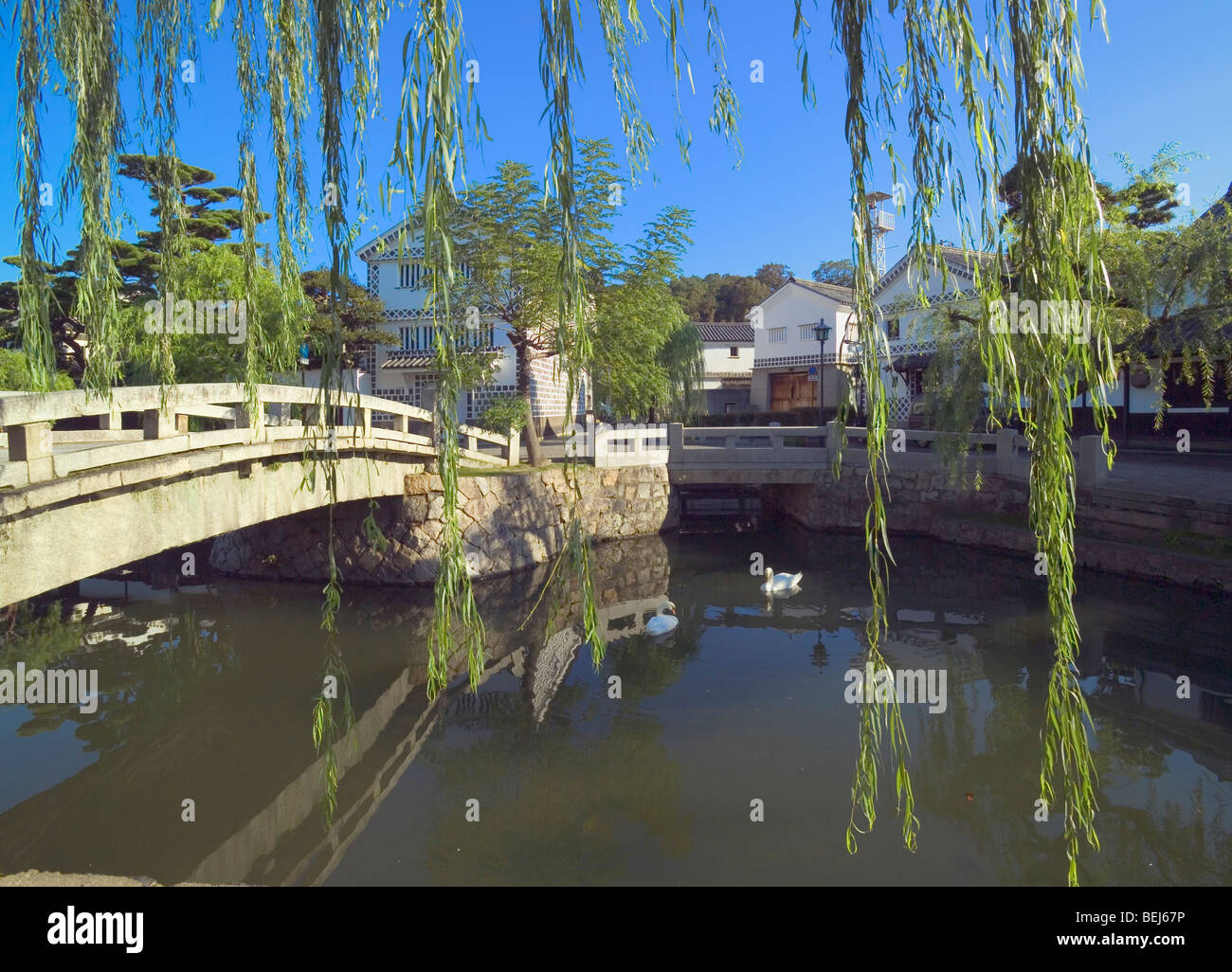 Bridge over the river and houses in Kurashiki,  Okayama Prefecture,  Japan Stock Photo