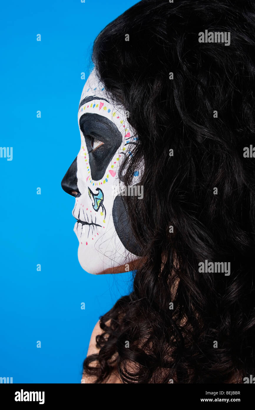 Side profile of a mid adult woman painted her face Stock Photo - Alamy