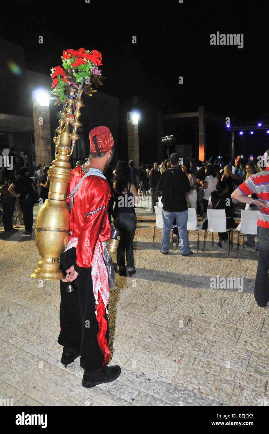 Israel, Acre, Man in traditional clothes sells tamarind juice Stock Photo