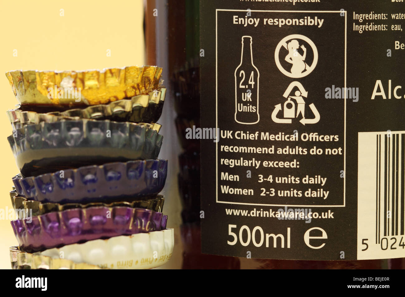 Drinkaware alcohol consumption health warning notice on beer bottle in UK encouraging responsible drinking Stock Photo