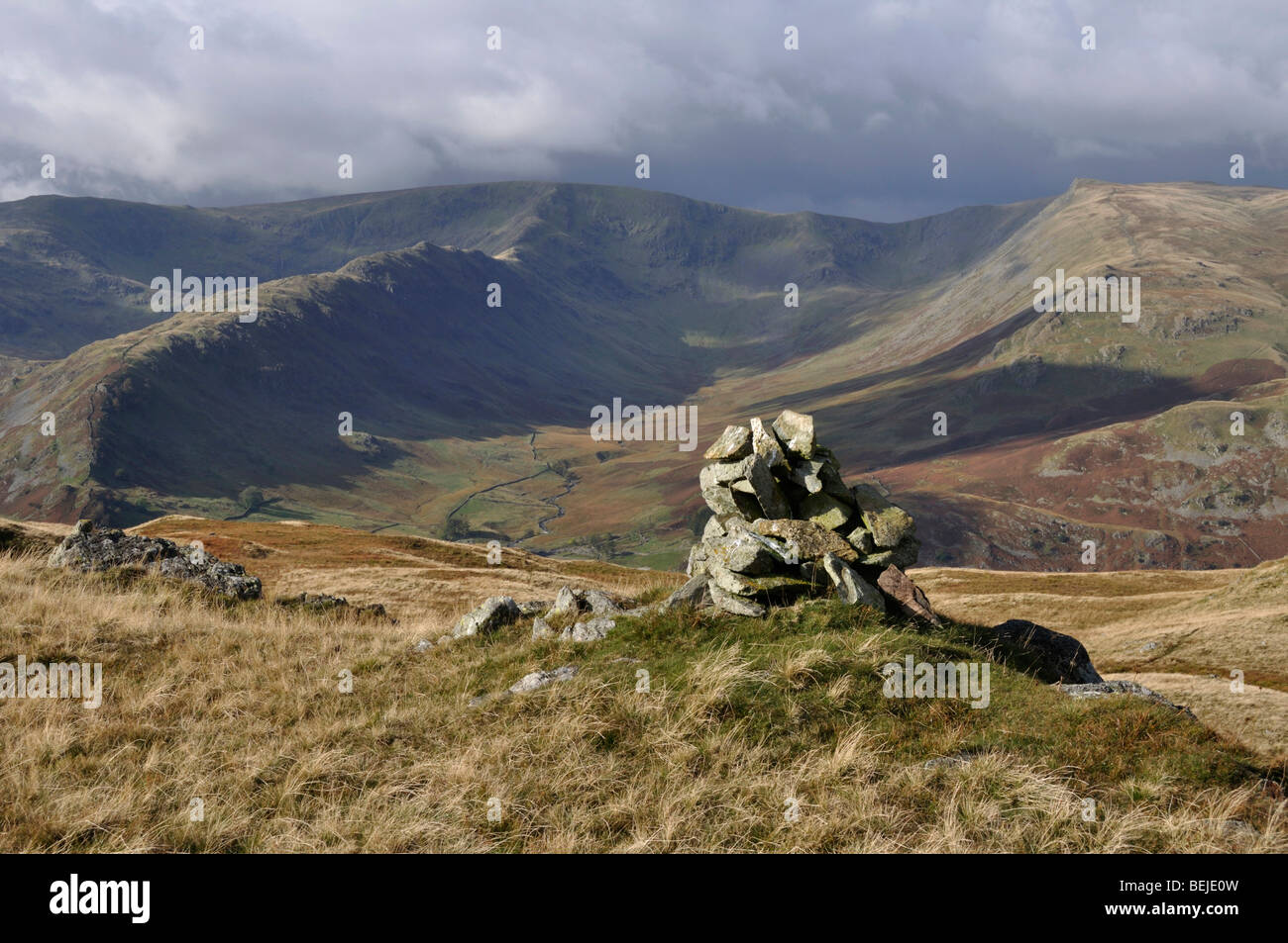 Summit cairn, Brown Howe, Lake District, England, looking west towards High Street Stock Photo