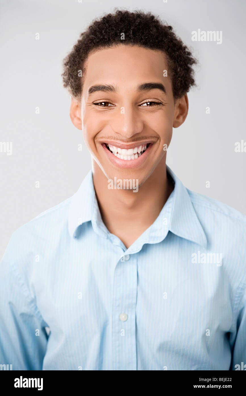 Portrait of a young man smiling Stock Photo - Alamy