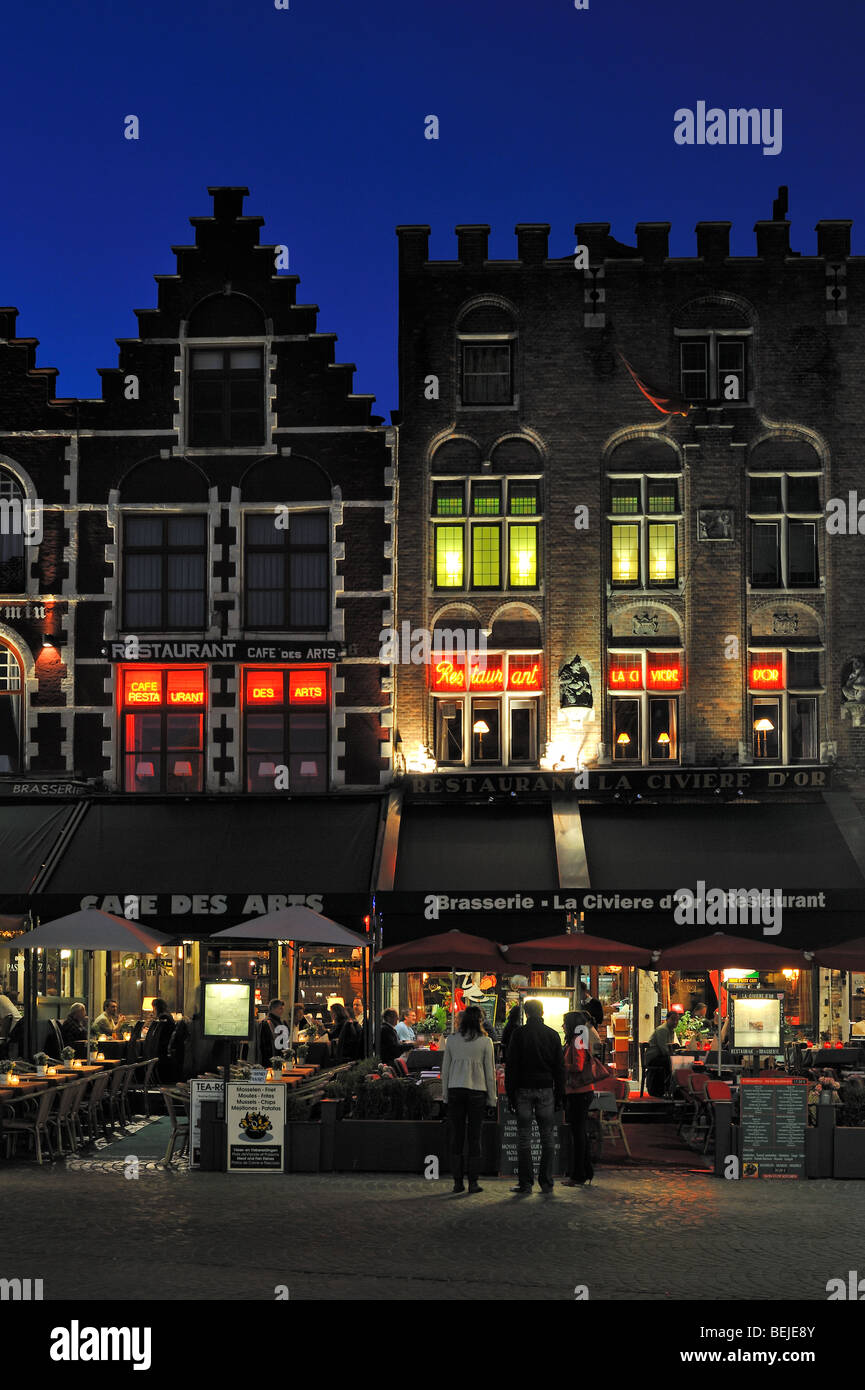 Medieval façades of restaurants at the Market Square at night in the city Bruges, West Flanders, Belgium Stock Photo