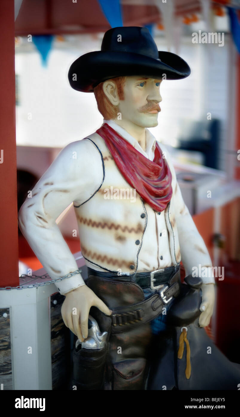 A model cowboy reaches for his gun Stock Photo