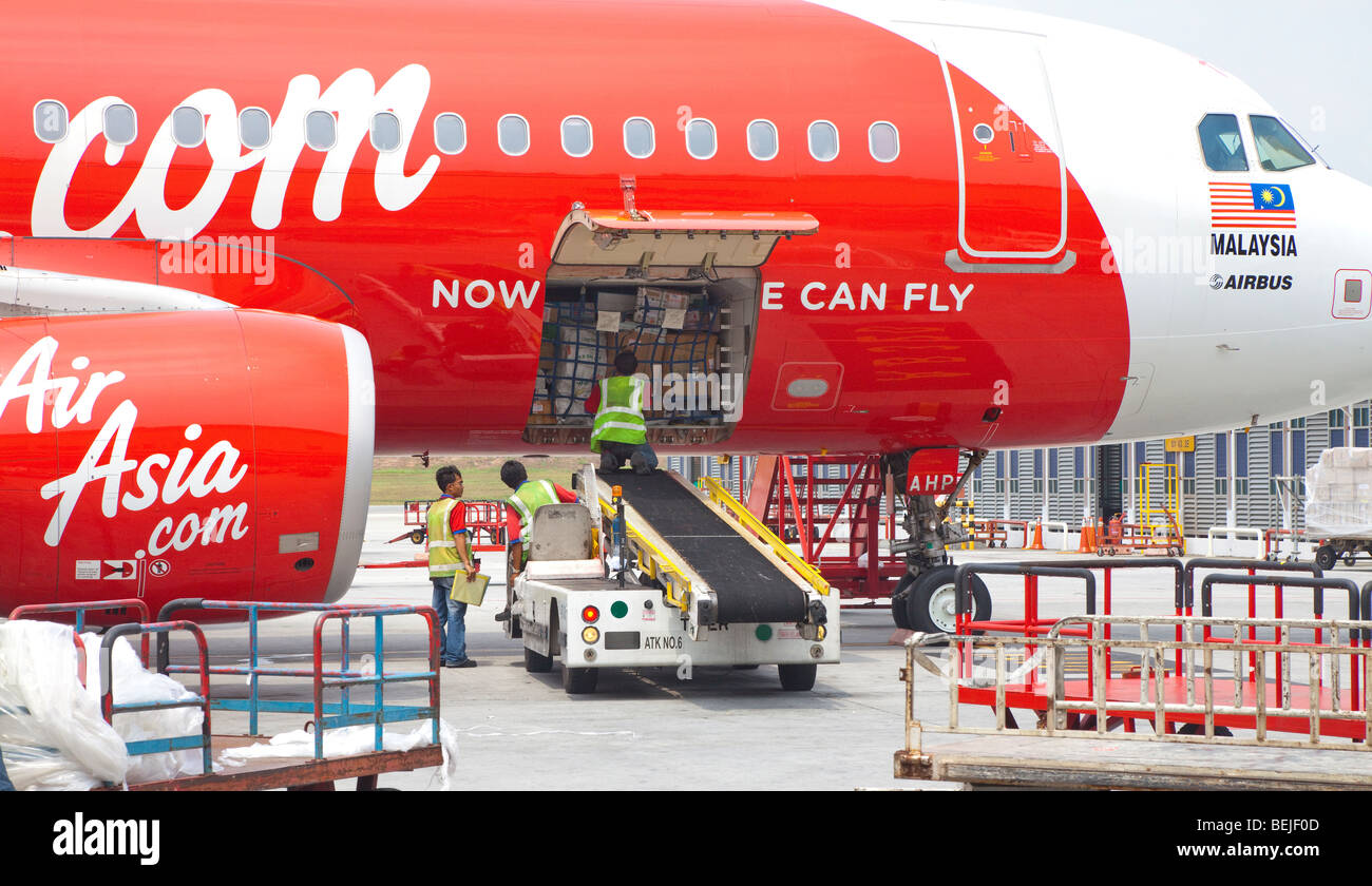Air Asia Airbus plane being serviced, baggage loading Stock Photo