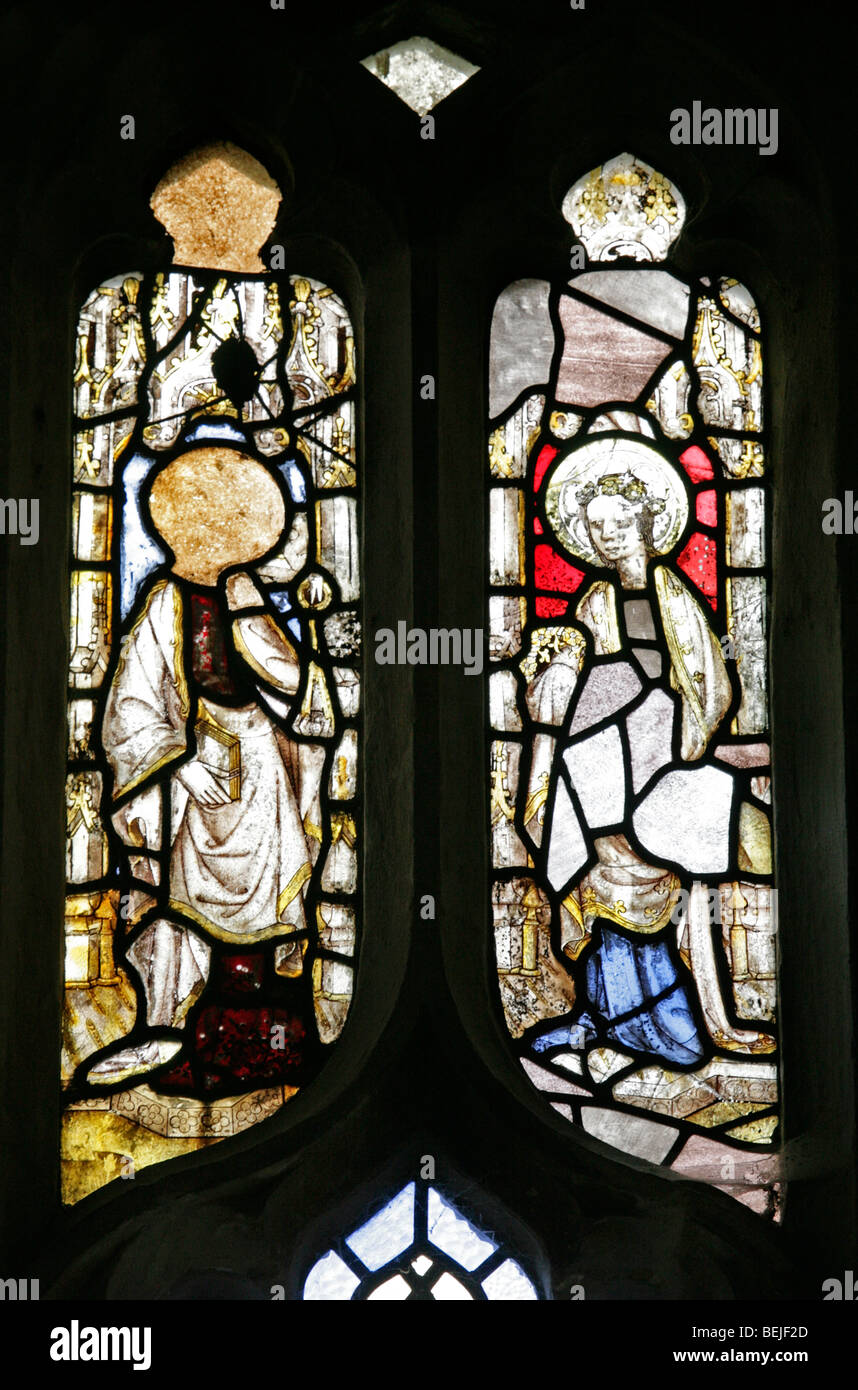 Detail of the medieval stained glass window depicting  and one other unidentified, Cley-next-the-sea Church, Norfolk Stock Photo