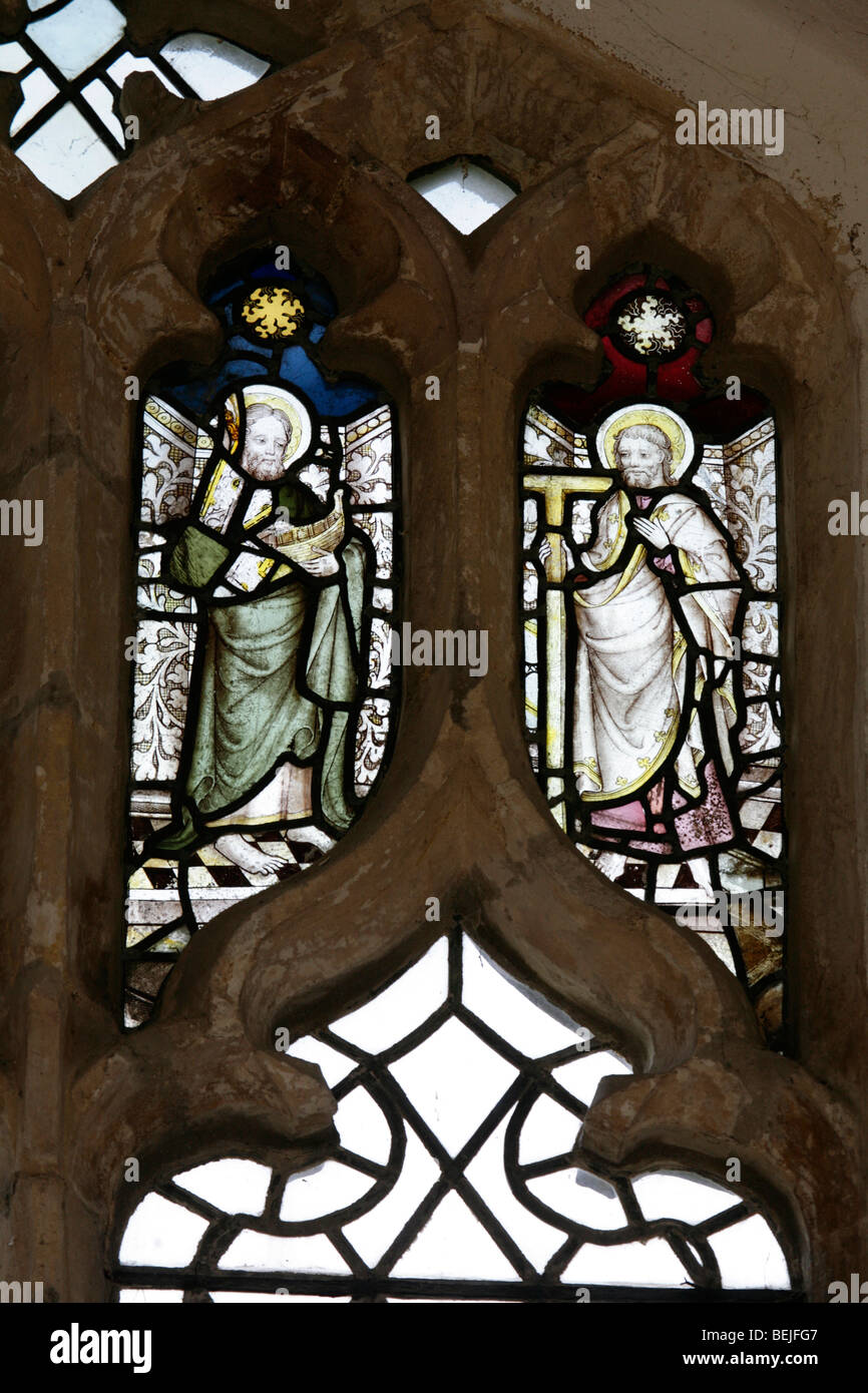 Detail of a medieval stained glass window depicting St Jude and St Thomas, St Mary's Church, Stody, Norfolk Stock Photo