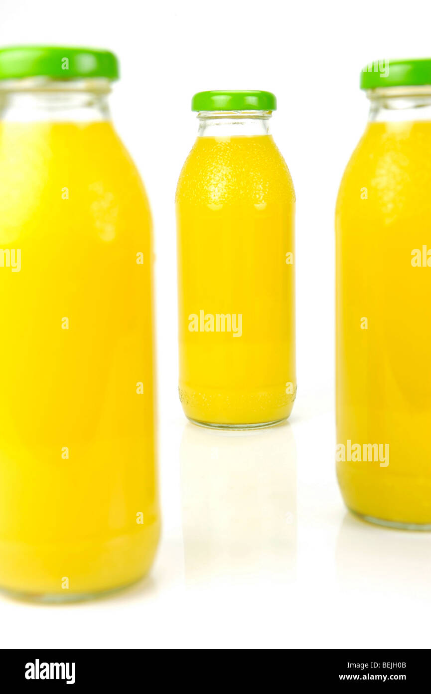 Bottles of orange juice isolated against a white background Stock Photo