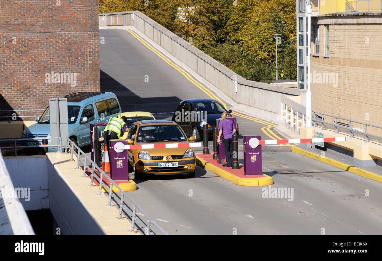 Car park entry barrier and parking ticket collection point multistory carpark Basingstoke town