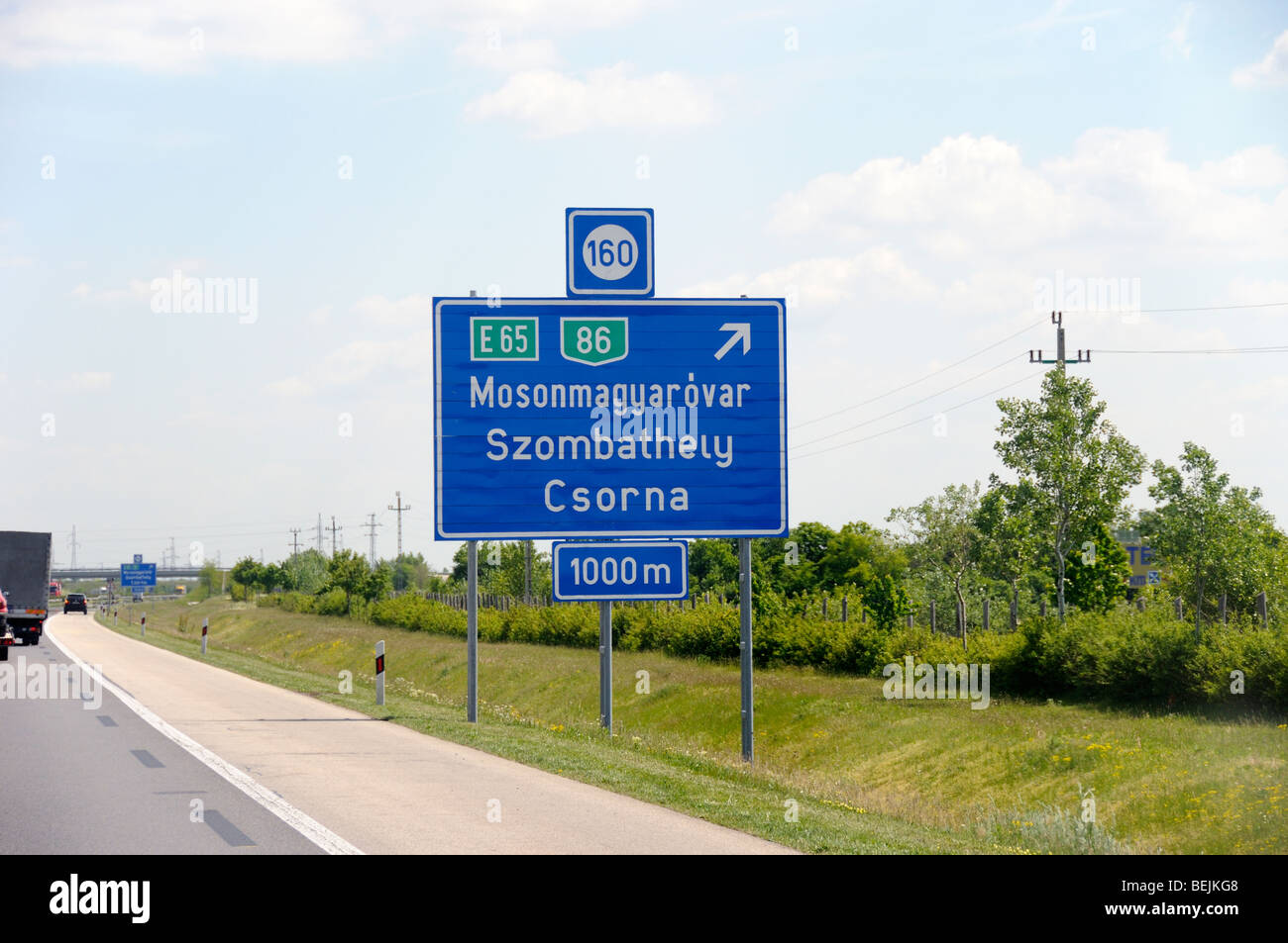 Road sign in Hungary Eastern Europe to Mosonmagyarovar Szombathely Csorna Stock Photo