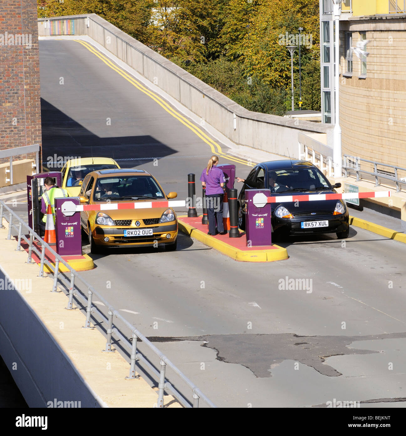 Car park entry barrier and parking ticket collection point multistory carpark Basingstoke town