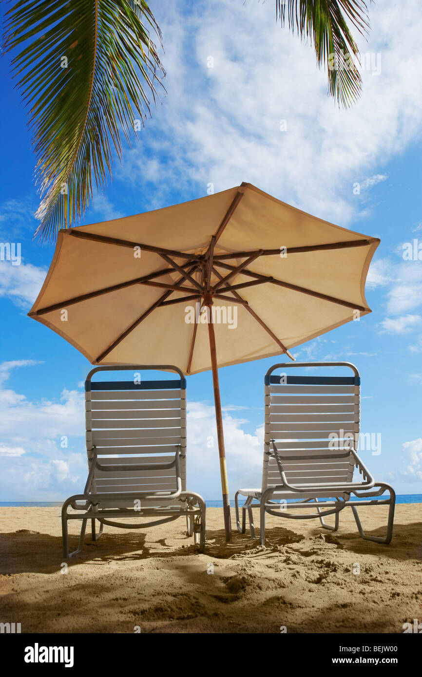 Two Outdoor Chairs And A Beach Umbrella On The Beach Ocean Park