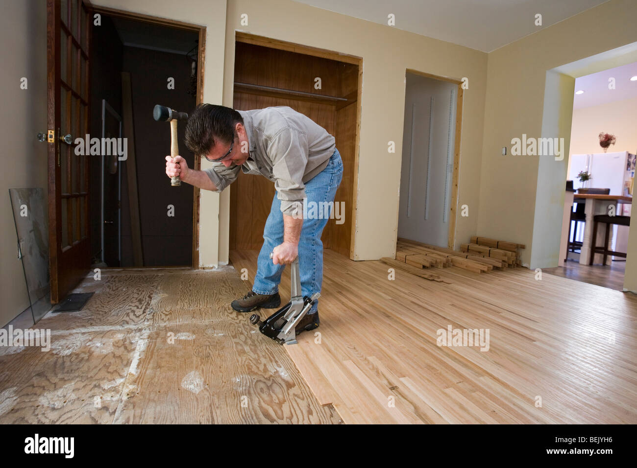 man installing oak floor Stock Photo